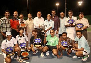 Winning moment:Sandeep Mittal (fifth from left), Deputy Inspector General of Police, Ramanathapuram range, giving away prizes to the winners of tennis tournament in Ramanathapuram on Sunday.— Photo: L. Balachandar