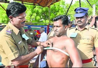 Procedure:Chest measurement being done on a police aspirant in Tuticorin on Tuesday.— Photo: N. Rajesh. 