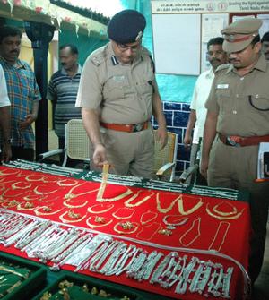 NICE: Deputy Inspector General of Police (Madurai Range), Sandeep Mittal, and Superintendent of Police, M. Manohar, inspecting the stolen goods. Photo: G. moorthy