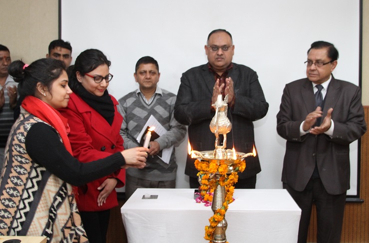 Teacher/students lighting lamp & invoking Godess Saraswati on the occasion of Basant Panchmi